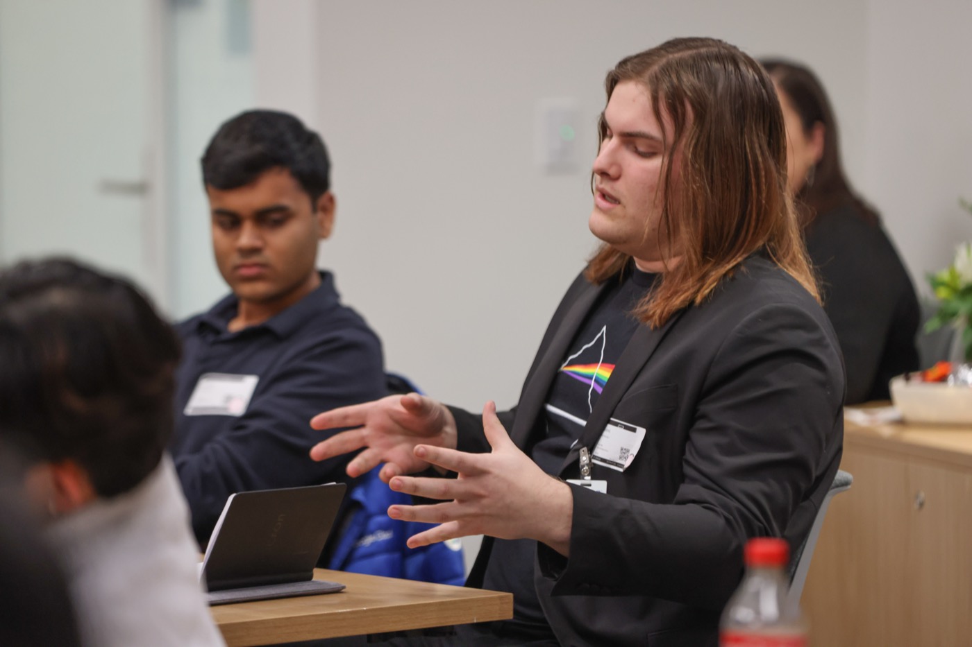An EDGE Scholar speaking during a site visit discussion
